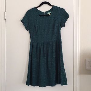 Turquoise dress with silver zipper on back